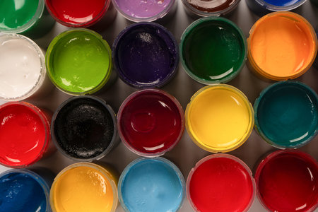 Gouache colorful paints set. Jars of gouache paint isolated on a white background.