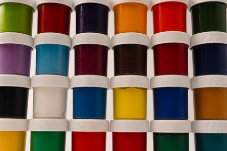 Gouache colorful paints set. Jars of gouache paint isolated on a white background.の写真素材