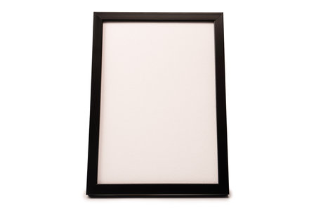 Black empty photo frame isolated on a white background.