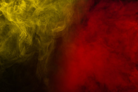 Yellow steam on a black background. Copy space.の写真素材