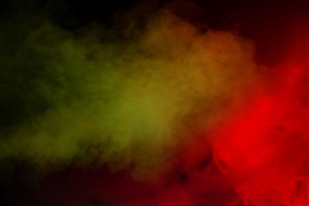 Red and green steam on a black background. Copy space.の写真素材
