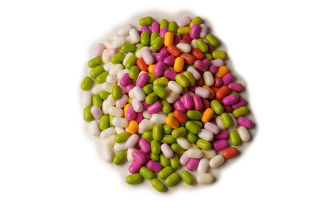 Sweet multicolored candies isolated on a white background.