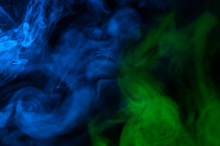Green steam on a black background. Copy space.の写真素材