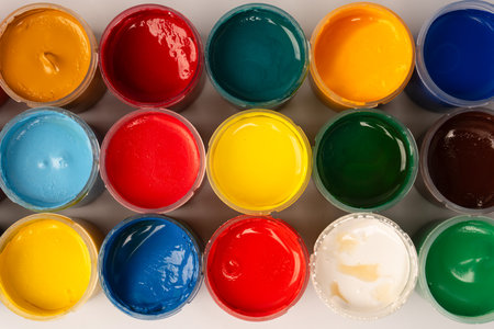 Gouache colorful paints set. Jars of gouache paint isolated on a white background.の写真素材