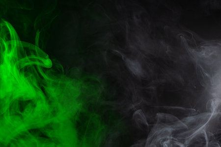 Green steam on a black background. Copy space.の写真素材