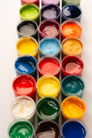 Gouache colorful paints set. Jars of gouache paint isolated on a white background.の写真素材