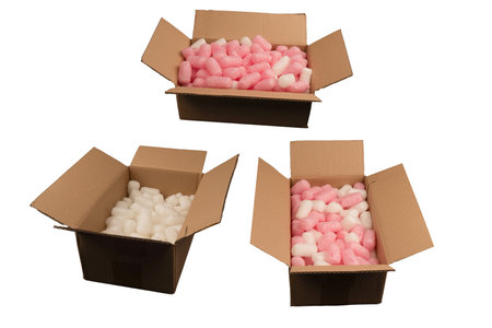 Cardboard box and white filling material in it isolated on a white background.の写真素材