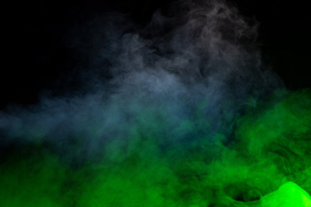 Blue and yellow steam on a black background.の写真素材
