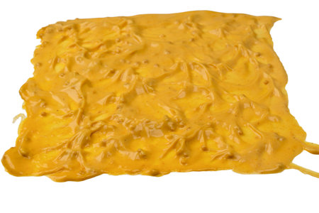 Yellow sauce splashes as a background. Top view.の写真素材