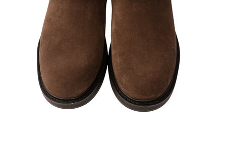 Brown leather boots isolated on a white background.の写真素材