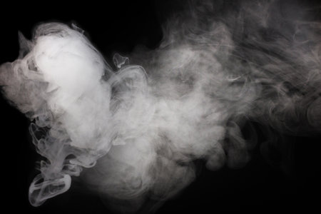 White steam on a black background. Copy space.の写真素材