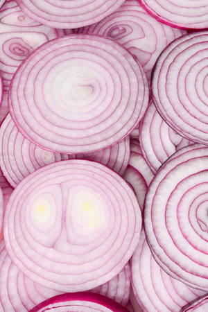 Onion slices as a background. Top view.の写真素材