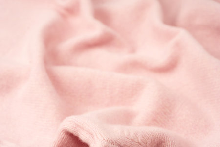 Soft pink cashmere sweater texture background. Top view.の写真素材