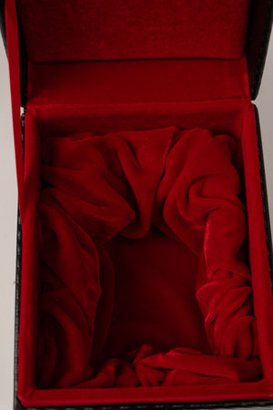 Empty box covered with red velvet isolated on a white background.の写真素材