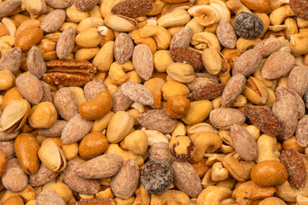 Mix of tasty salty nuts. A group of almonds, pistachios, walnuts, macadamia, cashews.の写真素材