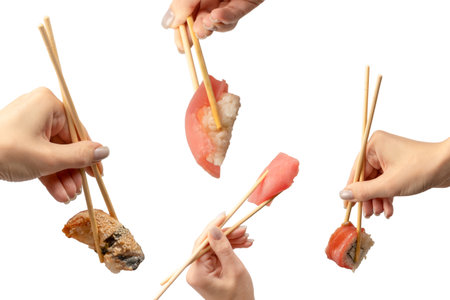 Sushi in a woman's hand isolated on a white background.の写真素材