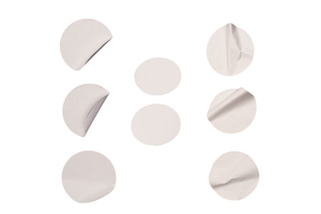 Round white stickers, blank tags labels isolated on a white background. Top view.の写真素材