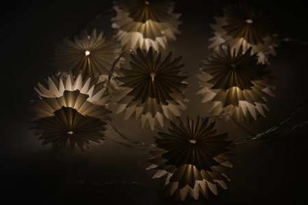 Light garland on a black background. Evening lights. Fetive decor.