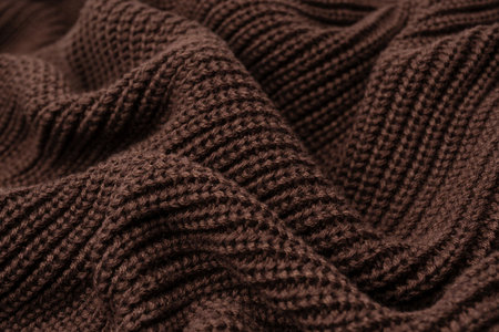 Brown sweater texture as a background. Top view.の写真素材