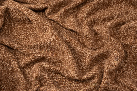 Soft brown merino wool sweater texture as a background. Top view.の写真素材