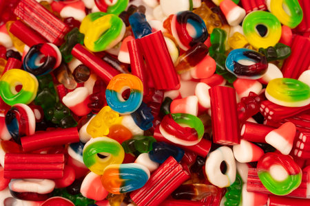 Assorted colorful gummy candies. Top view.