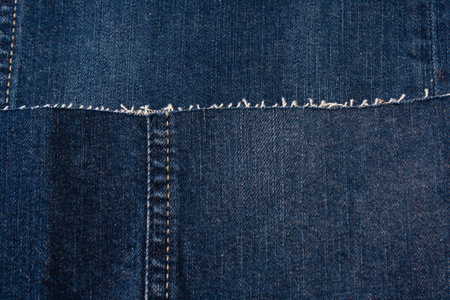 Blue denim fabric as a backgroundの写真素材