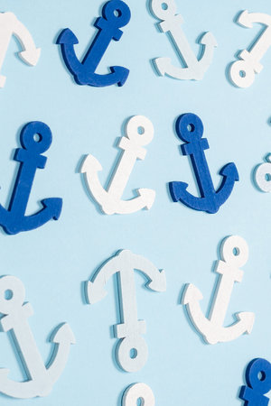 Blue anchors on a blue background. Pattern.の写真素材