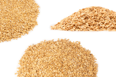 Oat-flakes isolated on a white background. Top view.