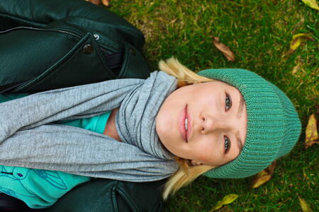 A beautiful smiling girl on the grass