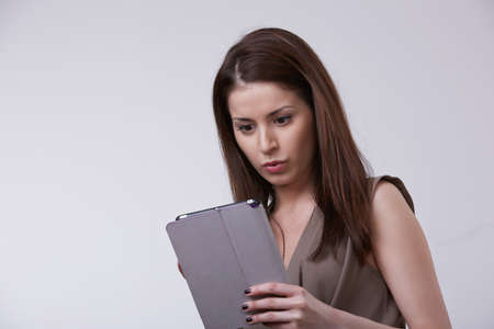 woman holding tablet pcの写真素材