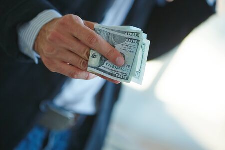 Businessman holding money in his hands