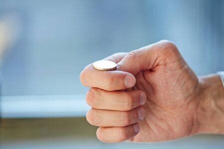 hand with euro coinの写真素材