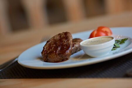 steak with sauce and vegetablesの写真素材