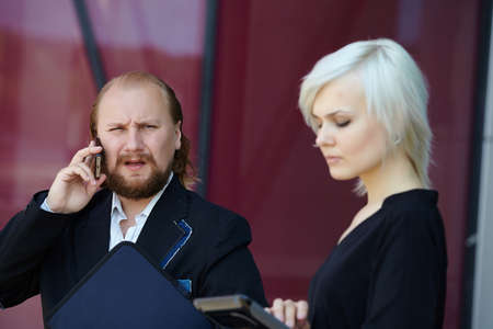 businessman and business woman are discussing