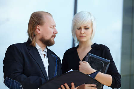 businessman and business woman are discussingの写真素材