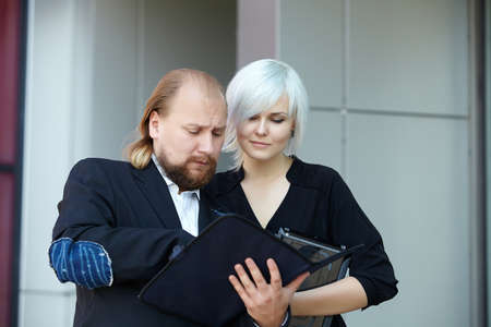 businessman and business woman are discussingの写真素材