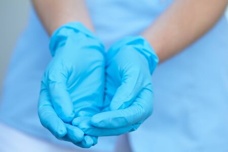 woman doctor in medical glovesの写真素材