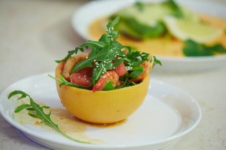 salad in grapefruit peelの写真素材