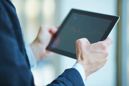 men holding digital tablet