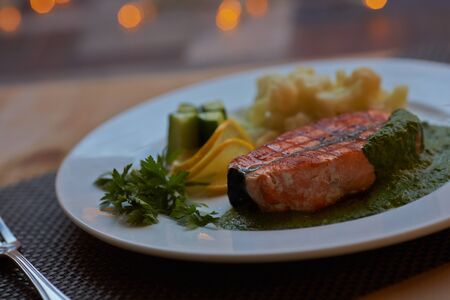 salmon steak with vegetablesの写真素材