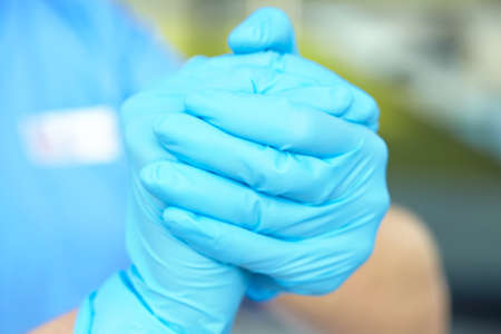 woman doctor in medical glovesの写真素材