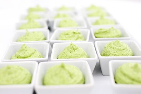 butter mixed with herbs in small plates at the buffet