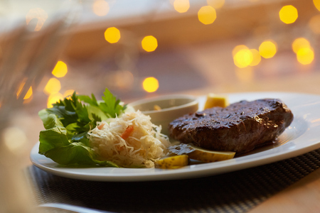 steak with sauce and vegetablesの写真素材