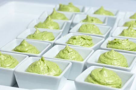 butter mixed with herbs in small plates at the buffetの写真素材