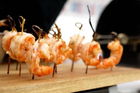 fried shrimp on skewersの写真素材