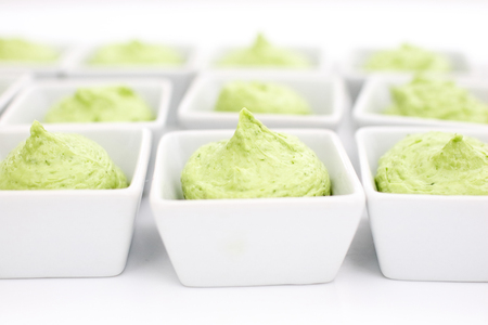 butter mixed with herbs in small plates at the buffetの写真素材