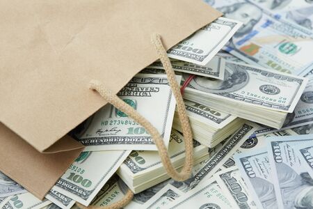 a lot of money out of a paper bagの写真素材