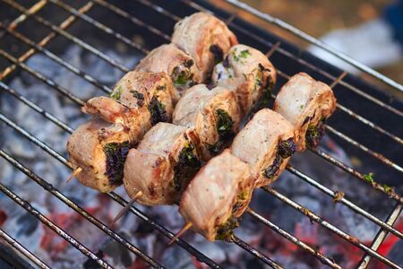 meat rolls grilled on skewersの写真素材