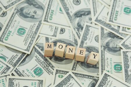 much money. Wooden blocks - the inscription moneyの写真素材