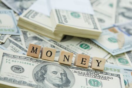 much money. Wooden blocks - the inscription moneyの写真素材